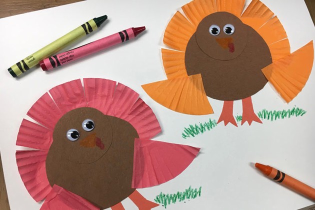Paper turkeys with feathers made from sections of cupcake wrappers.
